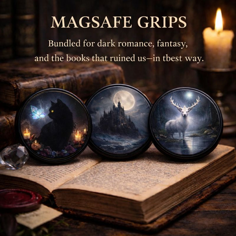 Three dark fantasy round MagSafe grips featuring a black cat with a ghostly butterfly, a moonlit gothic castle, and a white stag at night, displayed on an antique book