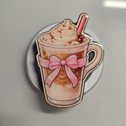 Coquette pink bow latte magnetic Kindle grip with MagSafe base on neutral background
