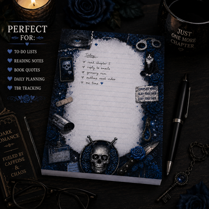 Notebook with skull design on a dark background with books and a candle