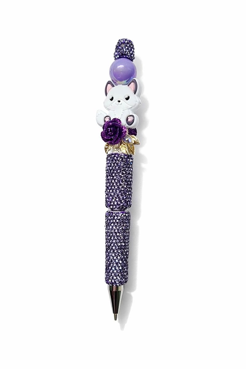 Fantasy bookish beaded pen featuring a white fox charm, purple rhinestone barrel, and luxury dark academia styling