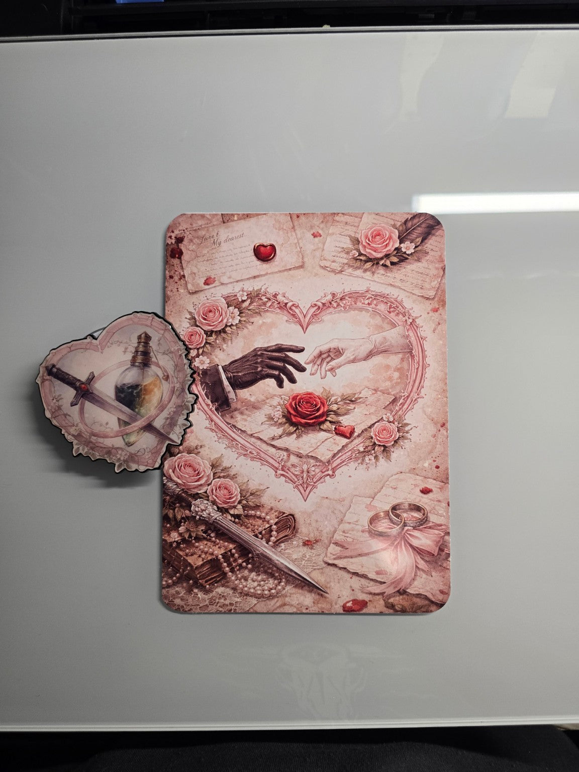 Romance inspired Kindle insert with intertwined hands, roses, and symbolic love and conflict artwork