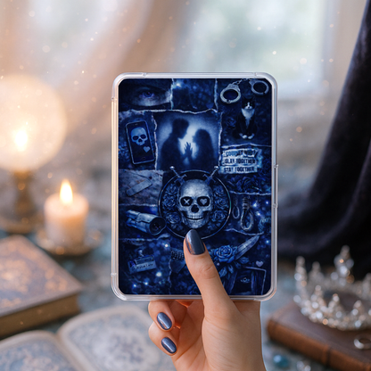 Hand holding a Kindle with a dark romance bookish collage insert featuring gothic imagery and a skull design.
