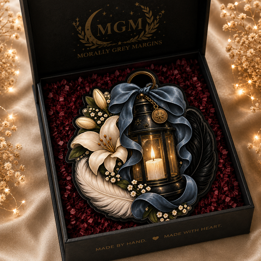 Dark romantic MagSafe Kindle grip with glowing lantern, white lily, black and white feathers, slate blue bow and gold charm